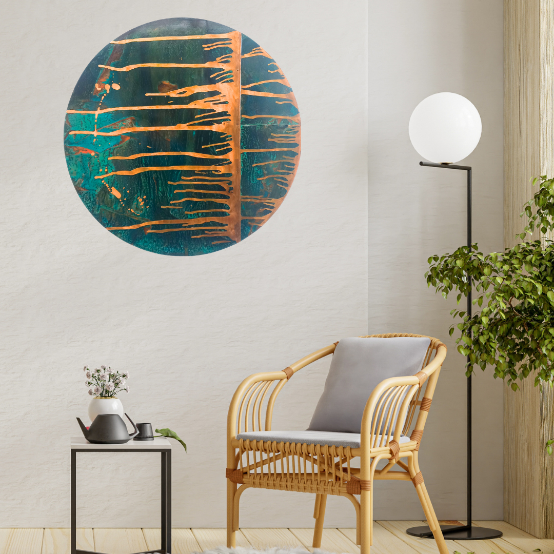 Modern interior with a round copper artwork, wicker chair, and floor lamp.