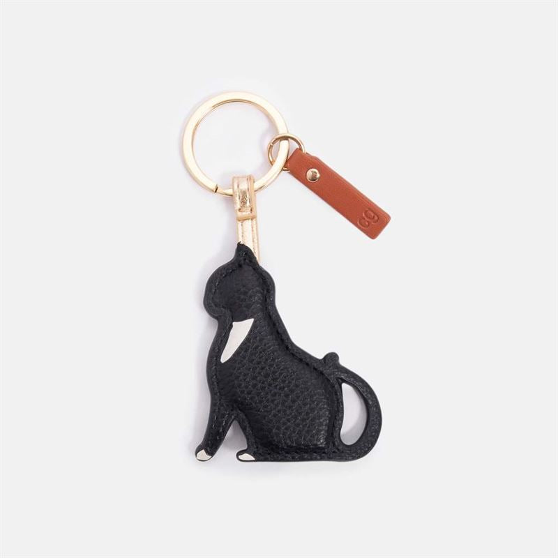 Black cat-shaped keychain with a gold ring on a white background