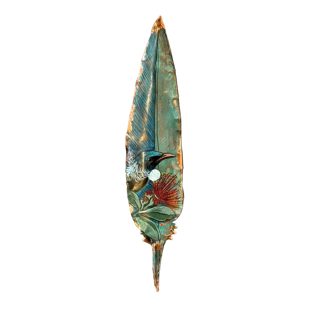 Decorative copper feather with a painted Tui bird on pohutakawa flower on a white background