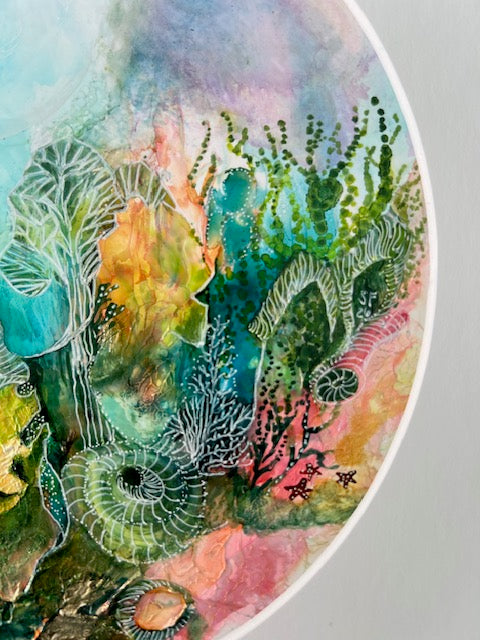 Colorful underwater scene with sea creatures on a circular background