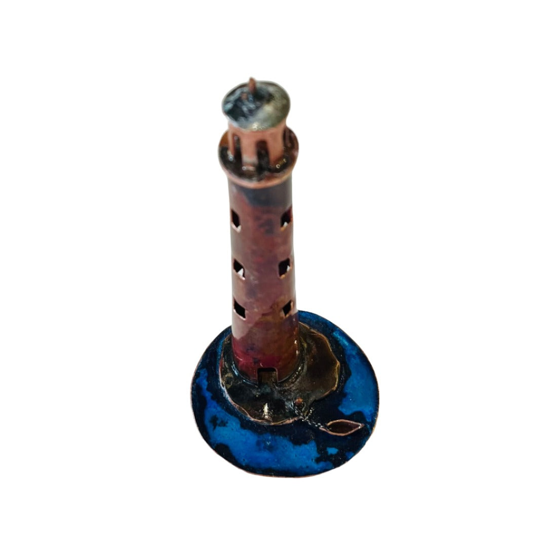 Lighthouse With Boat Sculpture