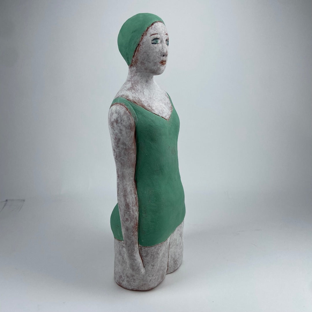 Female Swimmer In Green Cap