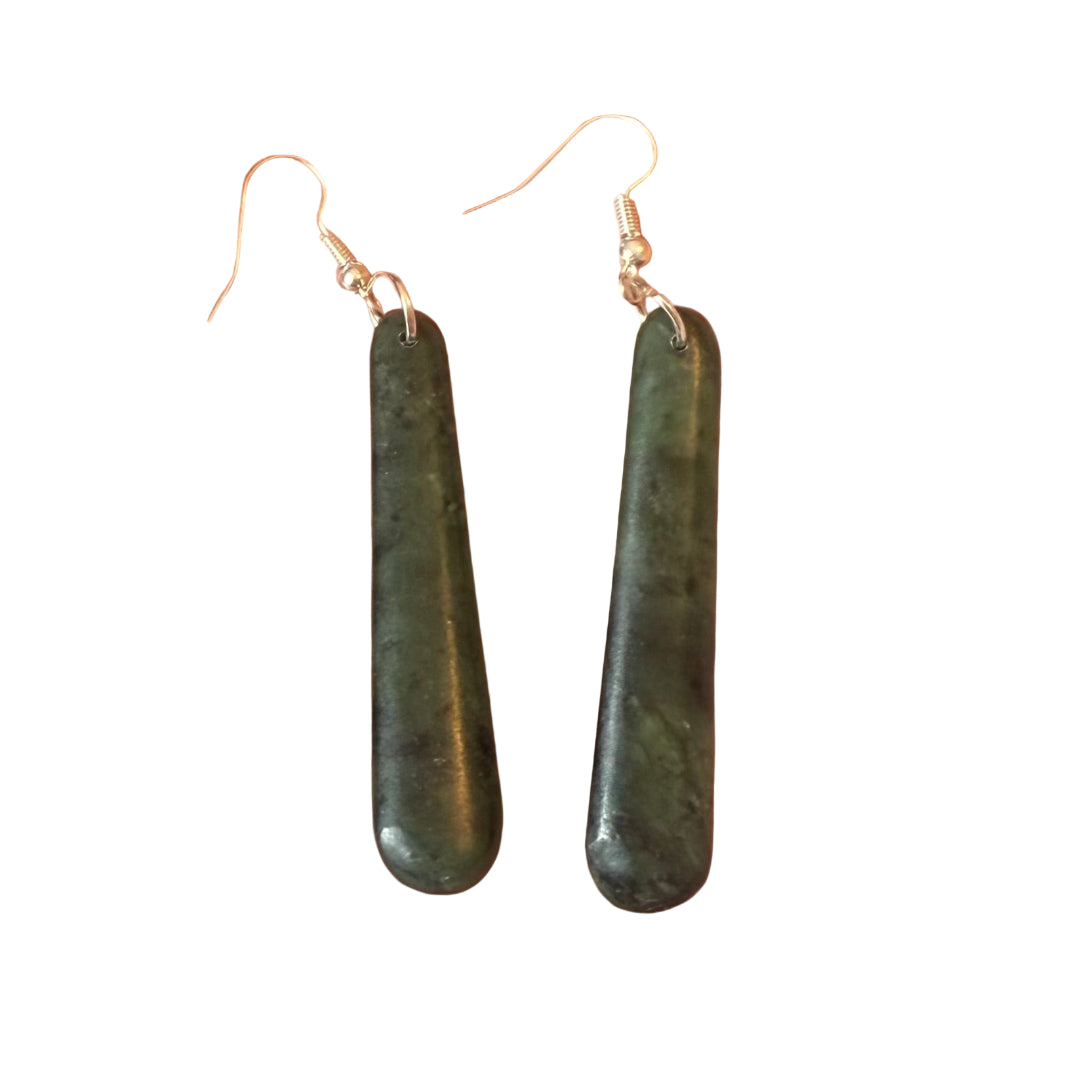 Greenstone drop earrings on a white  background