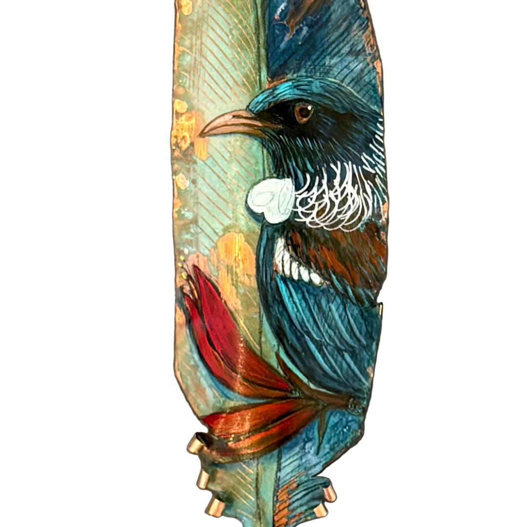 Decorative copper feather with a painted Tui bird on a white background