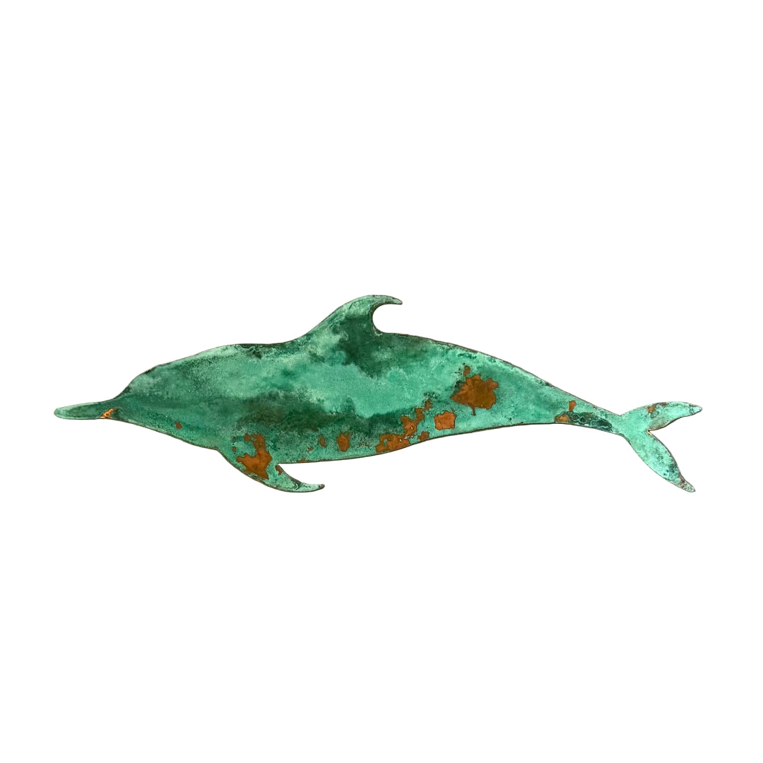 Copper green patina'd dolphin sculpture on a white background