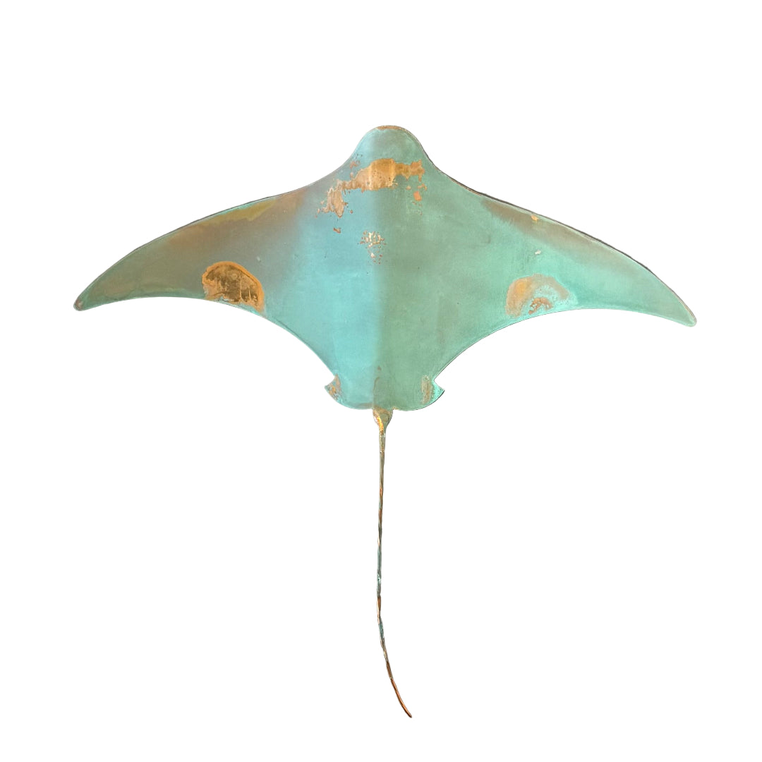 Copper stingray with grenn patina on a white background