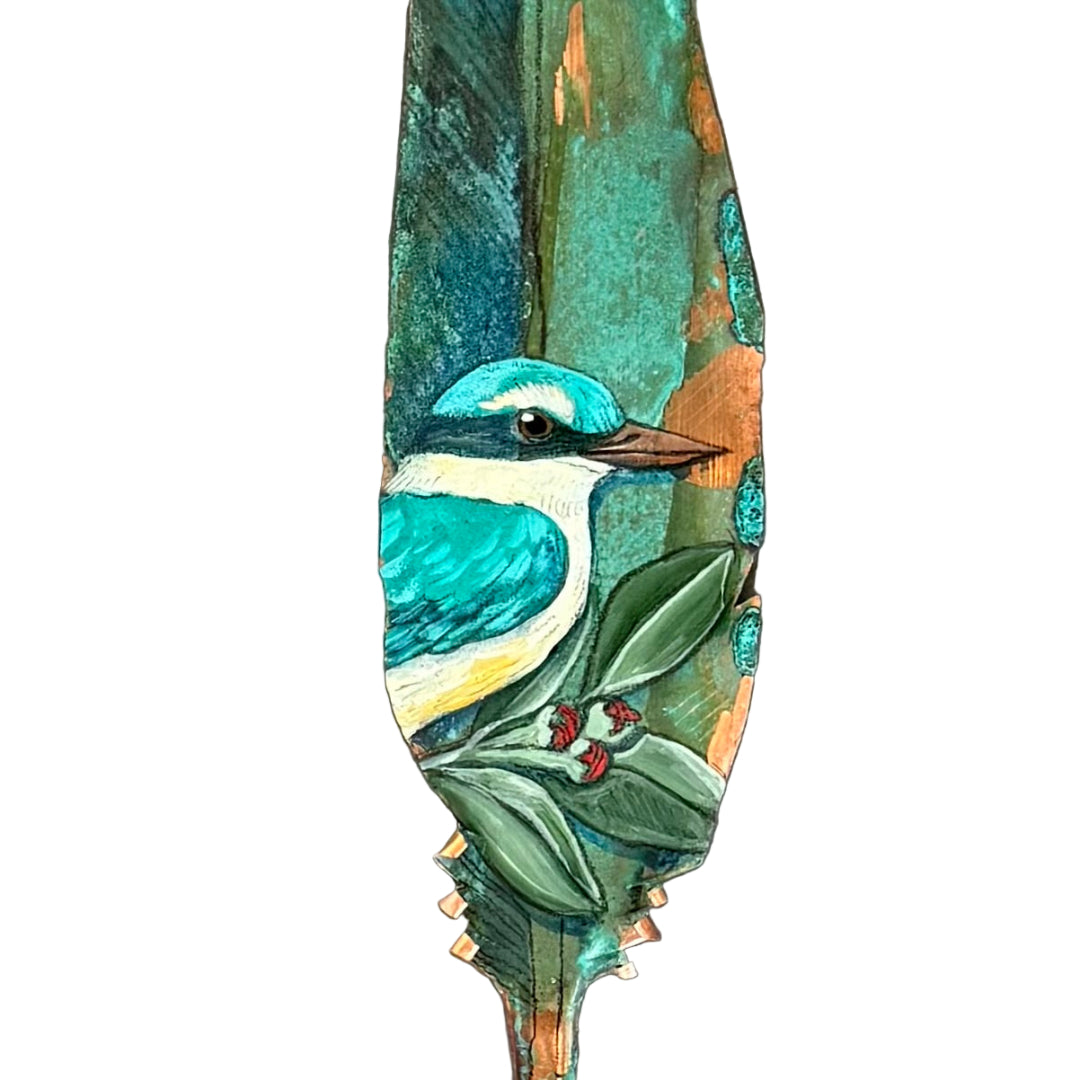 Decorative copper feather with a painted Kingfisher bird on a white background