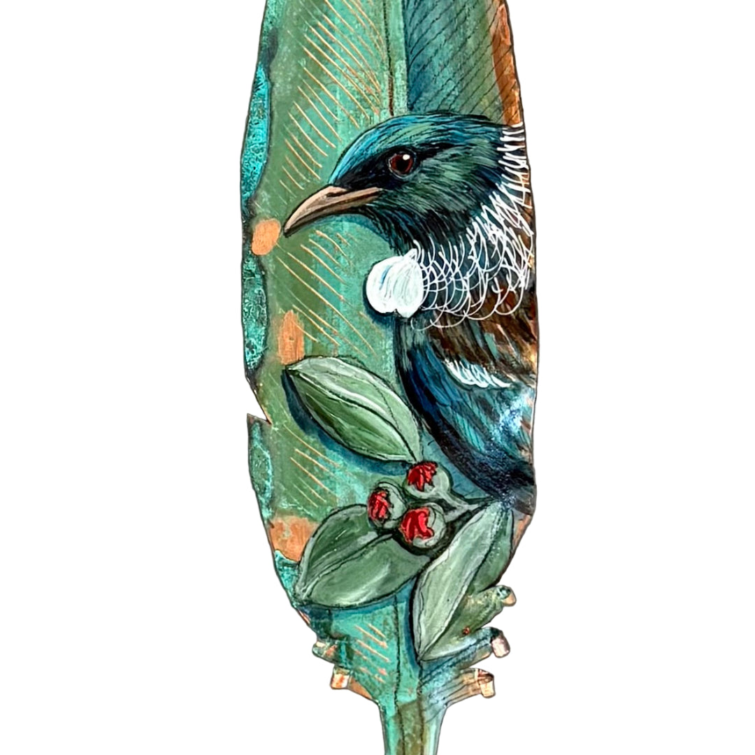 Decorative copper feather with a painted Tui bird on a white background