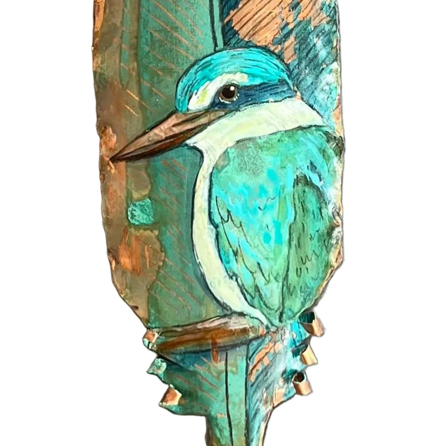 Decorative feather with a bird design on a white background