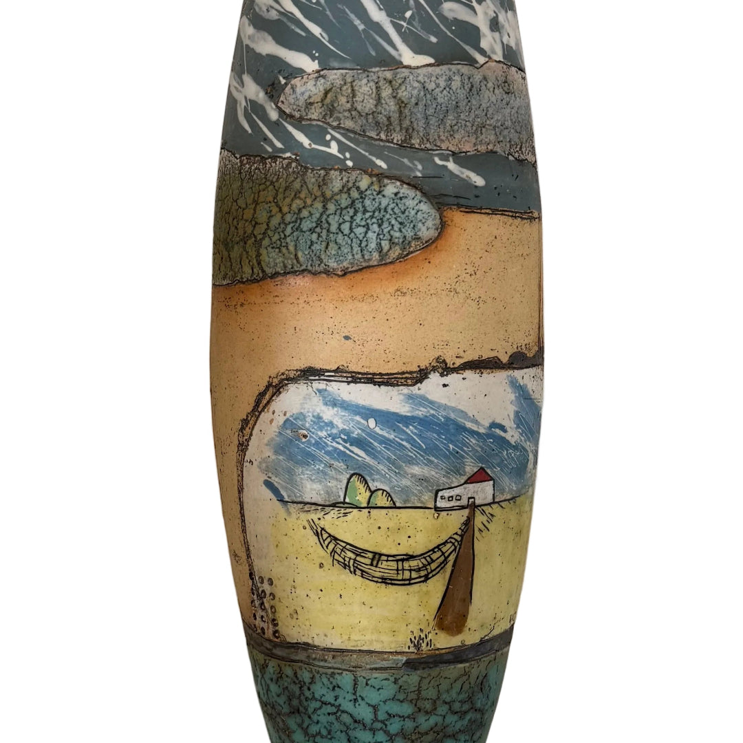 Decorative ceramic wall hanging with artistic design on a white wall