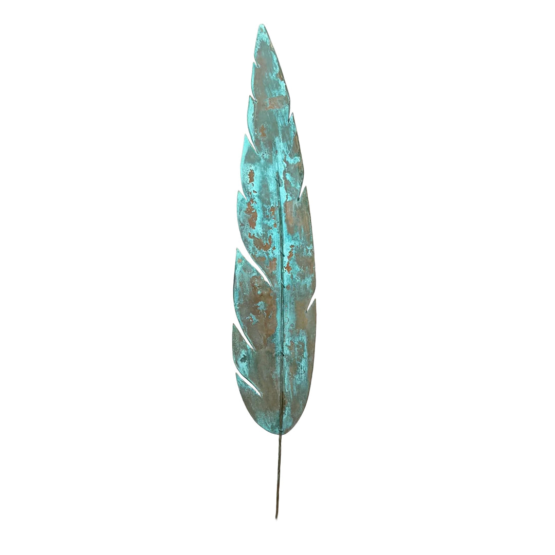 Large copper decorative feather with patina on a white bacground