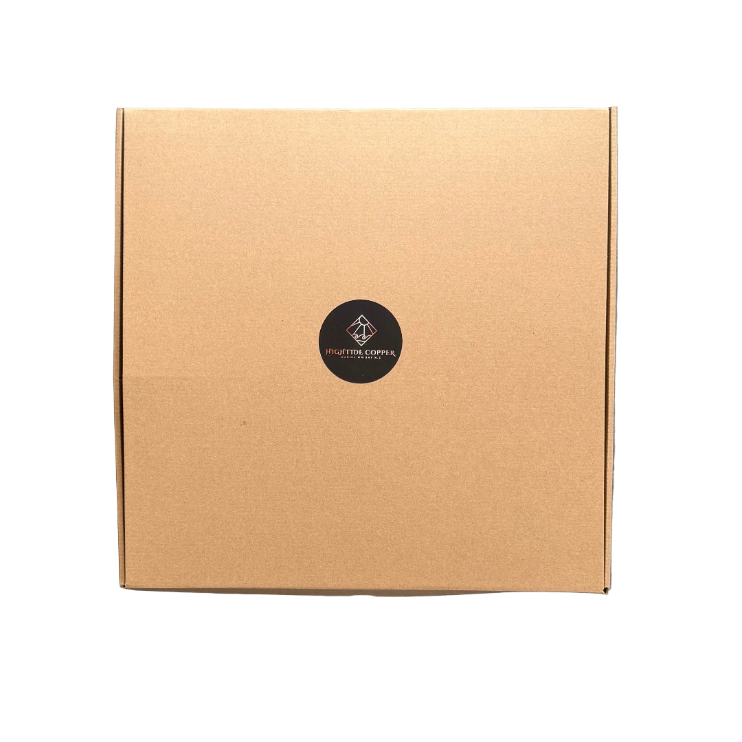 Brown cardboard box with a black circular logo on a white surface