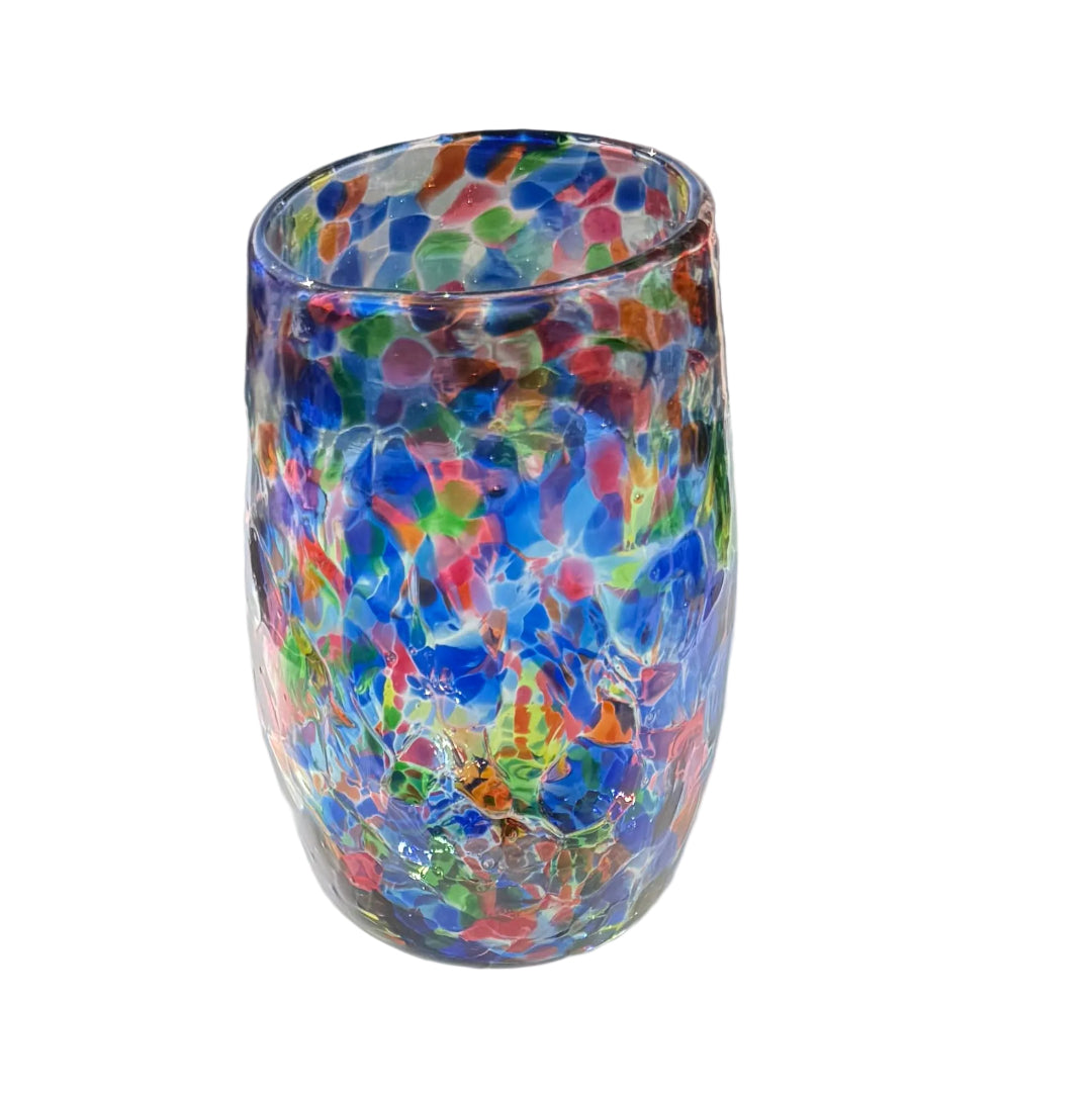 Colorful glass tumbler on a white surface