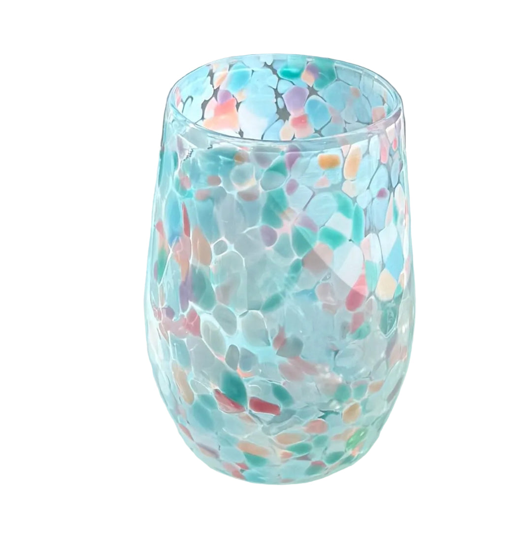 Colorful glass tumbler on a white surface