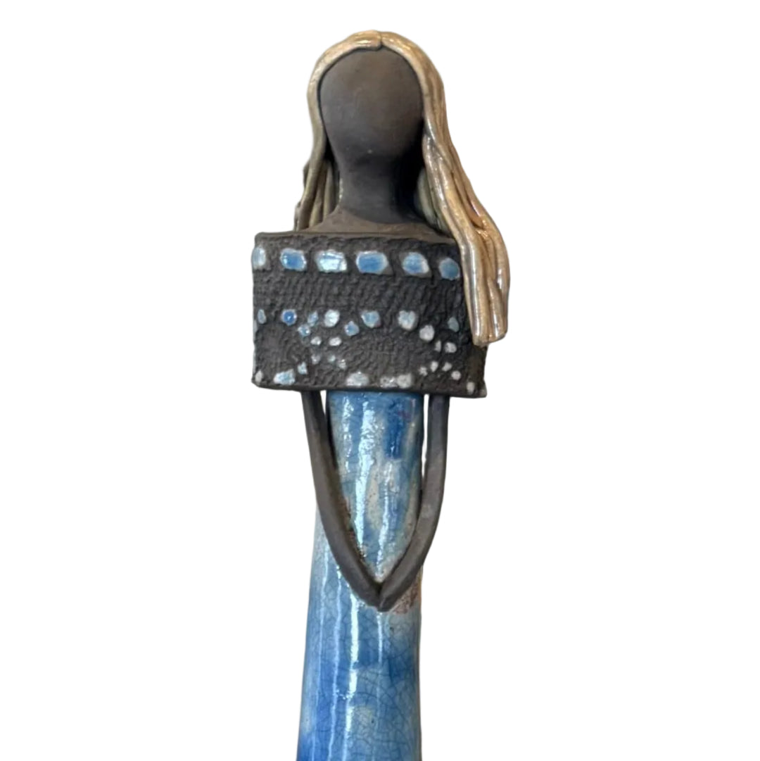 Tall blue and red ceramic sculpture on a white background.