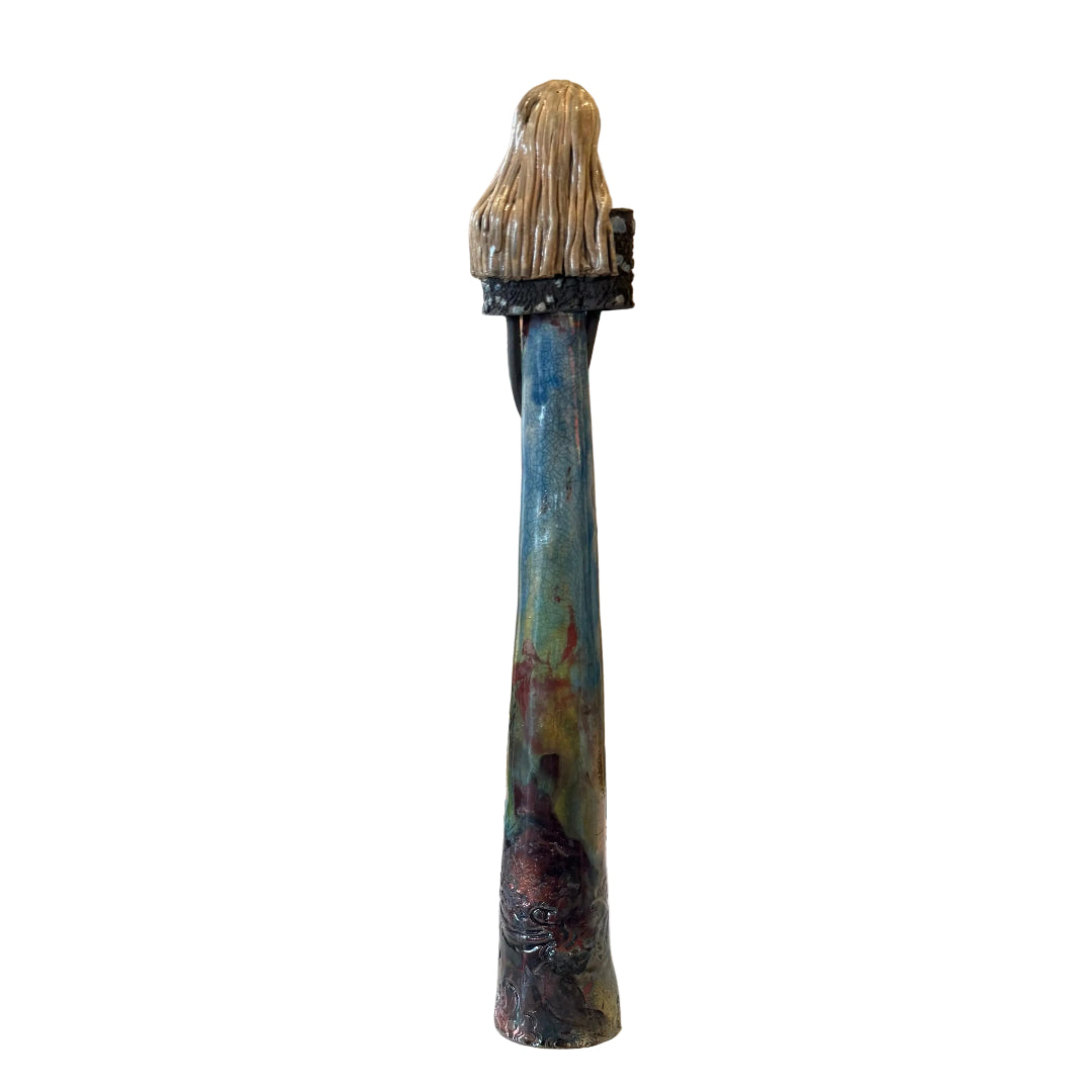Tall ceramic lady sculpture on a white background