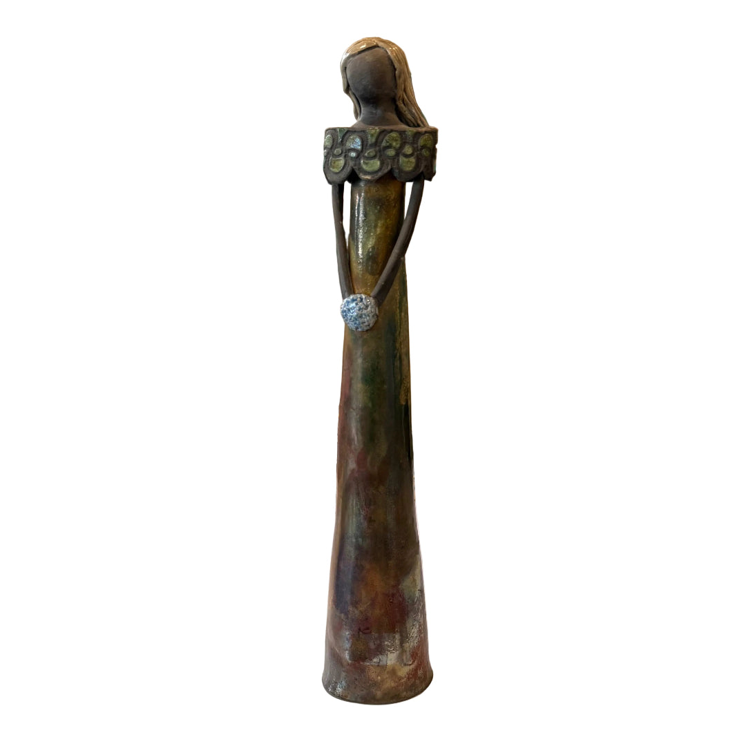 A tall, slender green & bronze-toned sculpture of a stylized female figure with a floral collar.