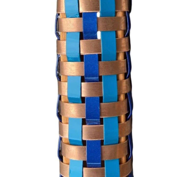 Wood with blue and copper woven pattern on a white background
