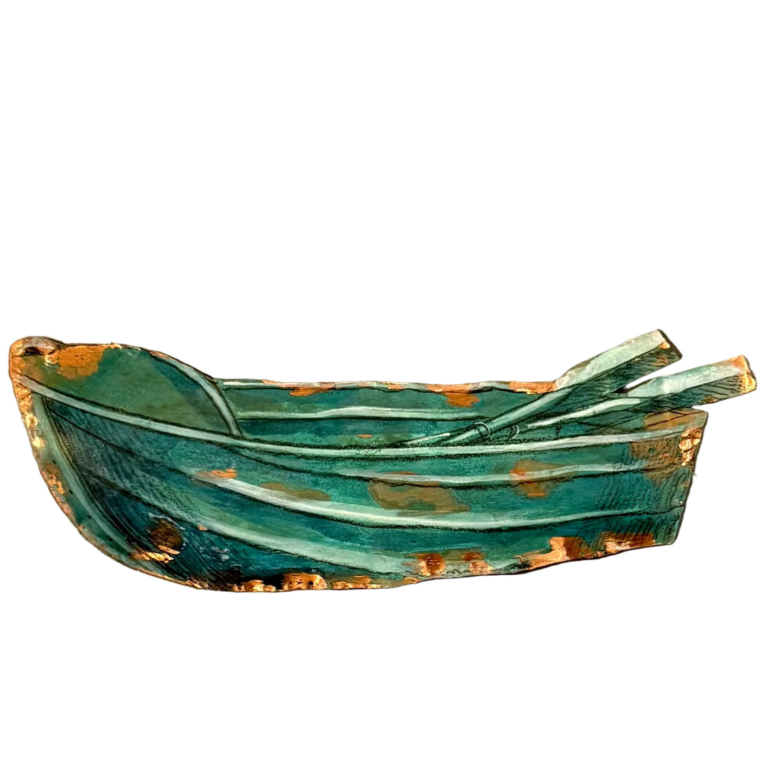 Copper wall scupture of a dinghy on a white background