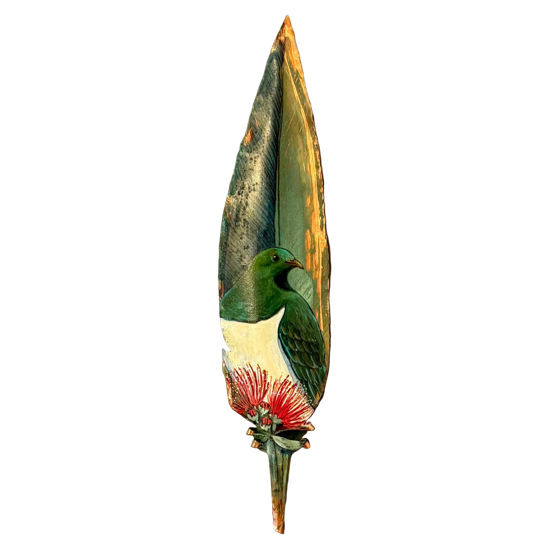 Painted copper feather with a Kereru or wood pigeon and pohutakawa flower on a white background