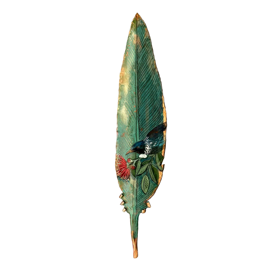 Copper feather with a painted Tui bird on pohutakawa flower on a white background