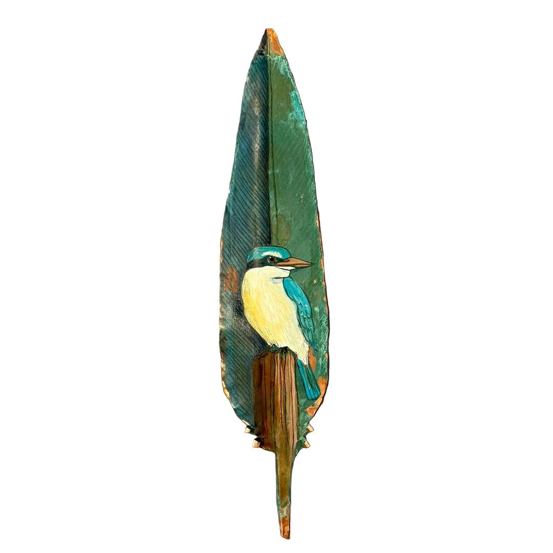 Painted copper feather with a kingfisher design on a white background