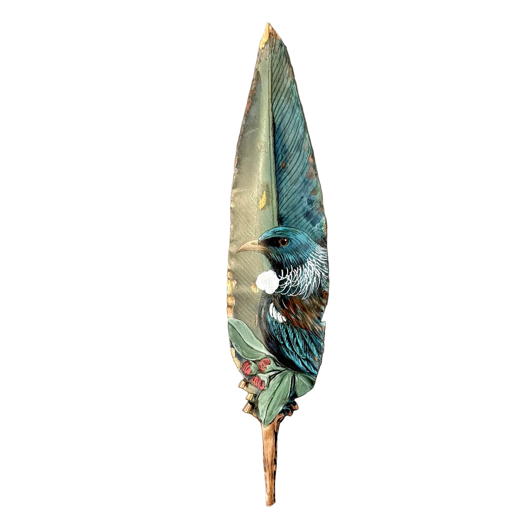 Decorative copper feather with a painted Tui bird on a white background