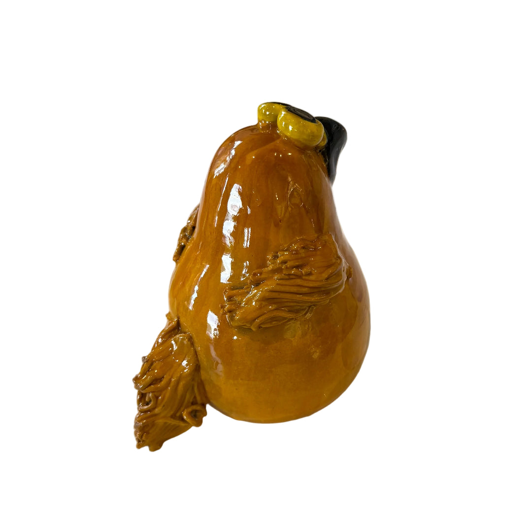 Ceramic Morepork owl sculpture on a white background