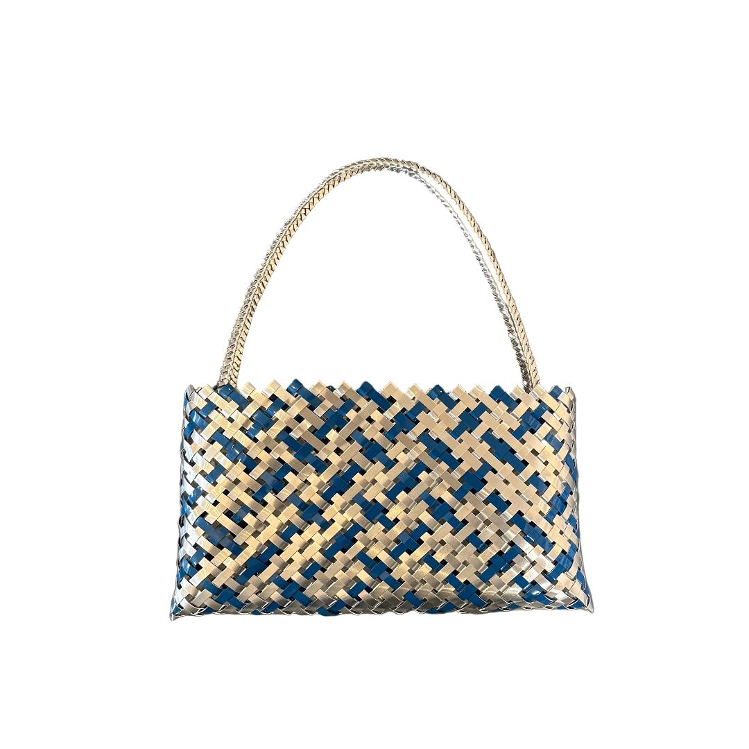 Woven teal blue and silver aluminium kete or bag on a white background