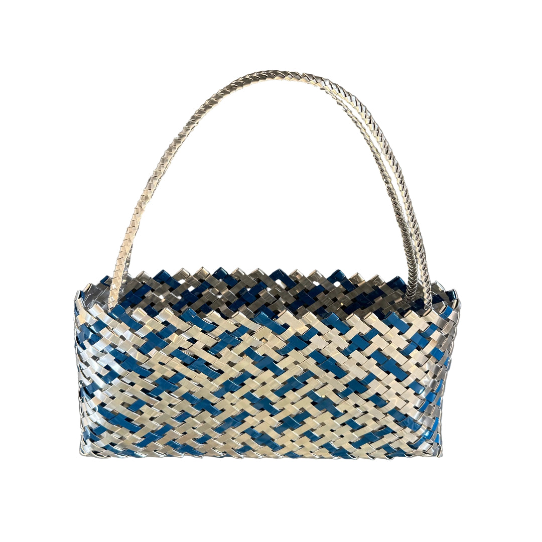 Woven teal blue and silver aluminium kete or bag on a white background