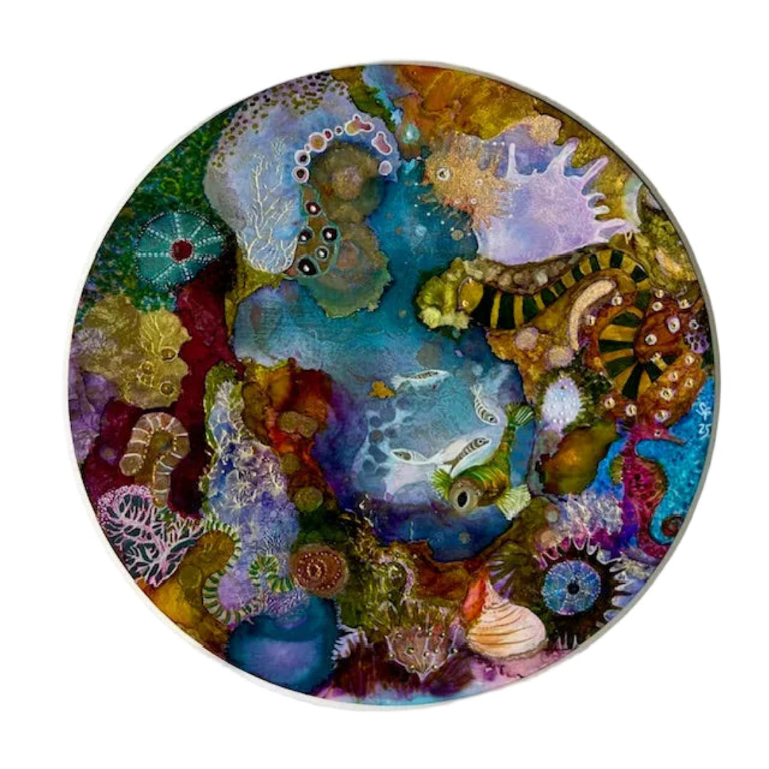 Circular artwork with colorful underwater scene on a white background