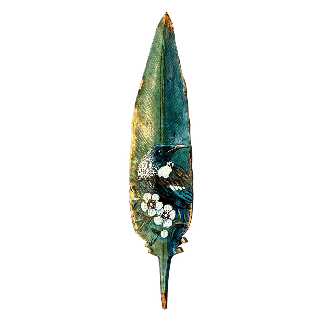 Copper feather wall art hand painted with a Tui bird on Manuka flowers against a white background.