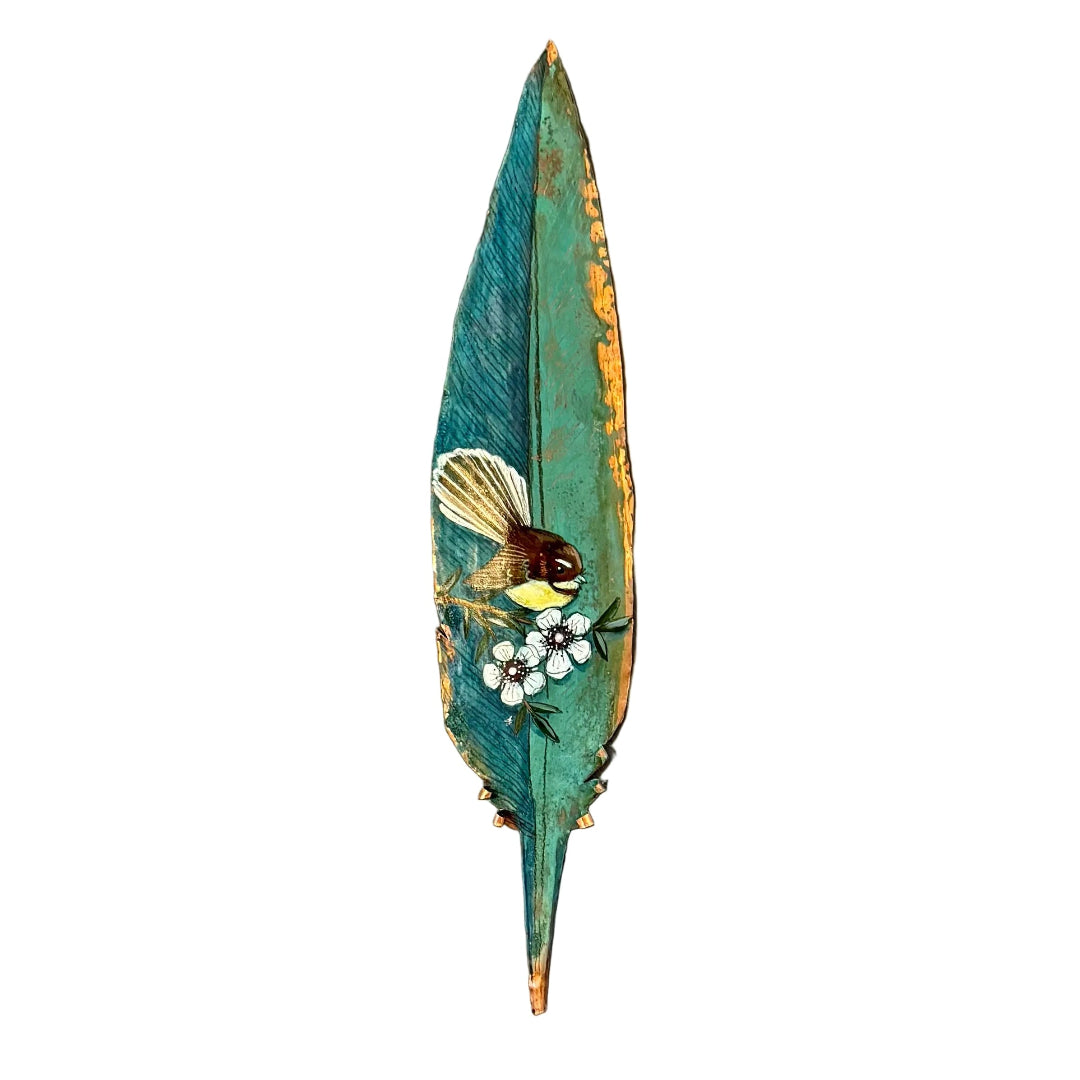Copper feather wall art hand painted with a Fantail bird on Manuka flowers against a white background.