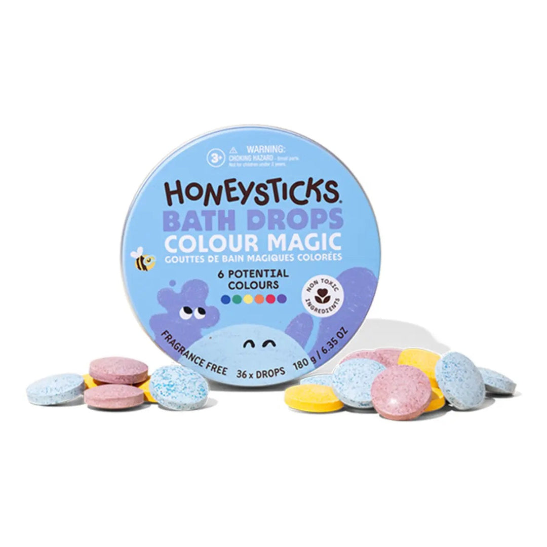 Honeysticks Bath Drops Colour Magic packaging with colorful bath bombs on a white background
