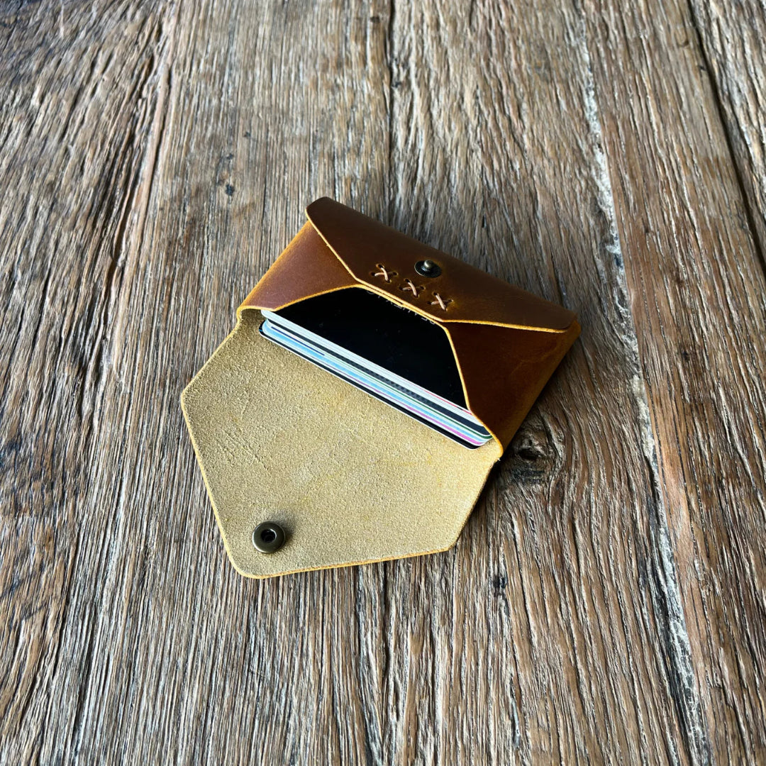 Leather card holder on a wooden surface