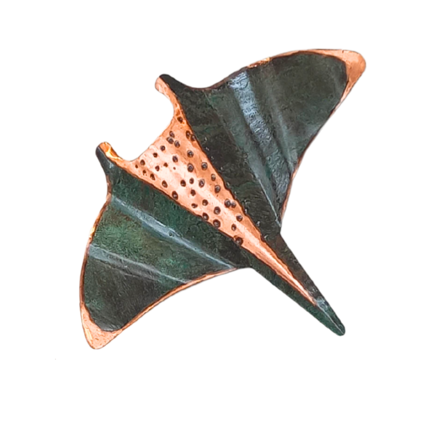 Copper wall manta ray with copper and green patina on a white background