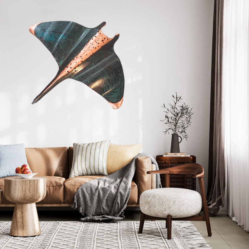 Modern living room with a large copper manta ray sculpture on the wall.