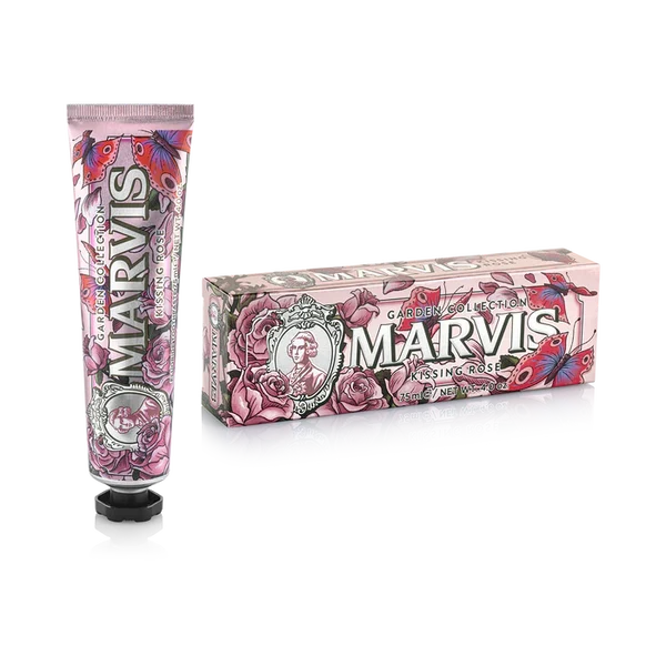A tube and box of Marvis Kissing Rose toothpaste, featuring a pink floral design with roses and butterflies on a white background.