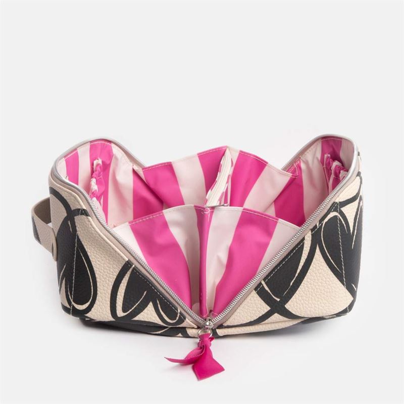 Zipped toilet bag with pink & white striped interior and black heart pattern on a white background