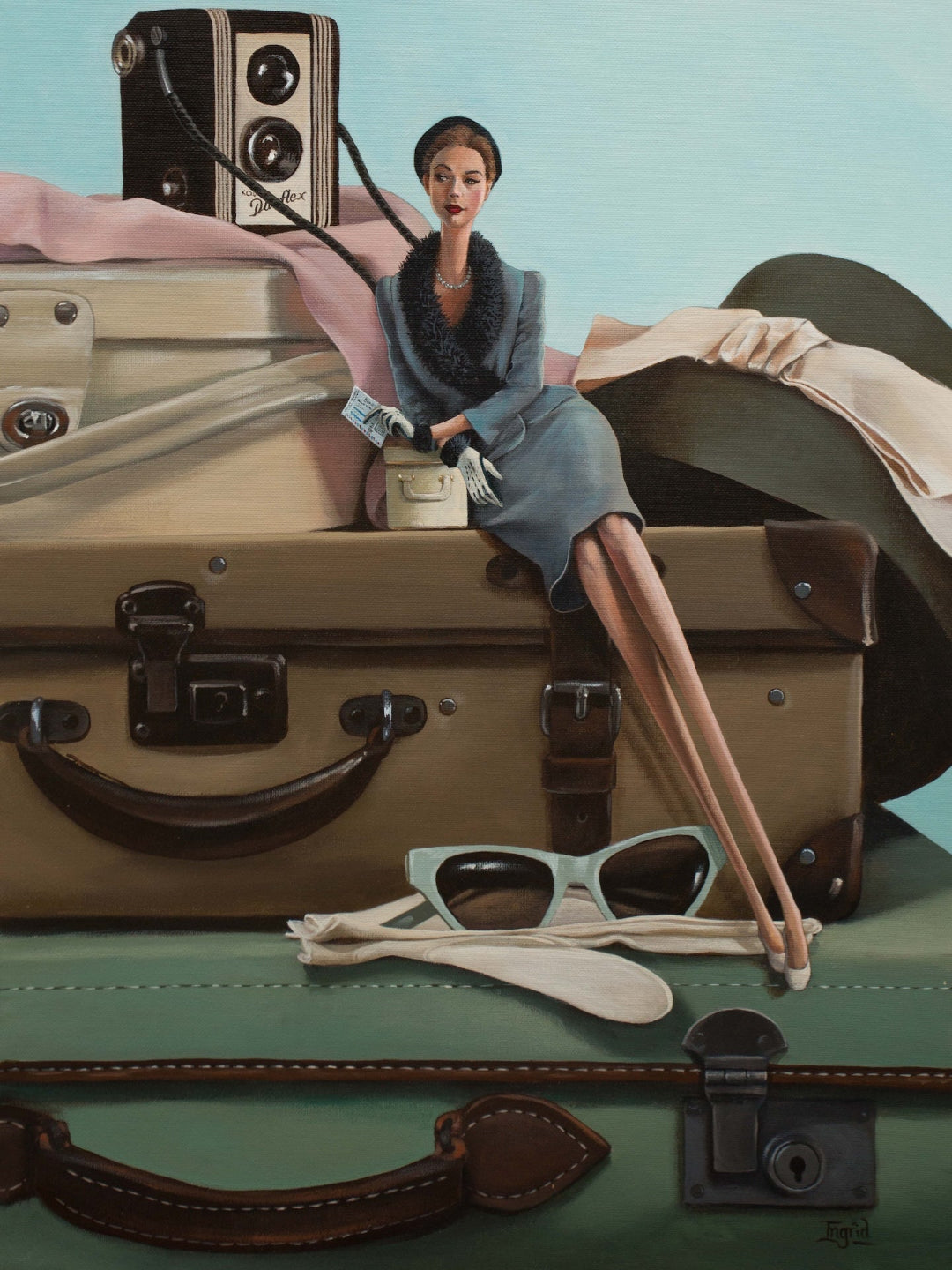 Woman sitting on a suitcase with vintage camera and sunglasses