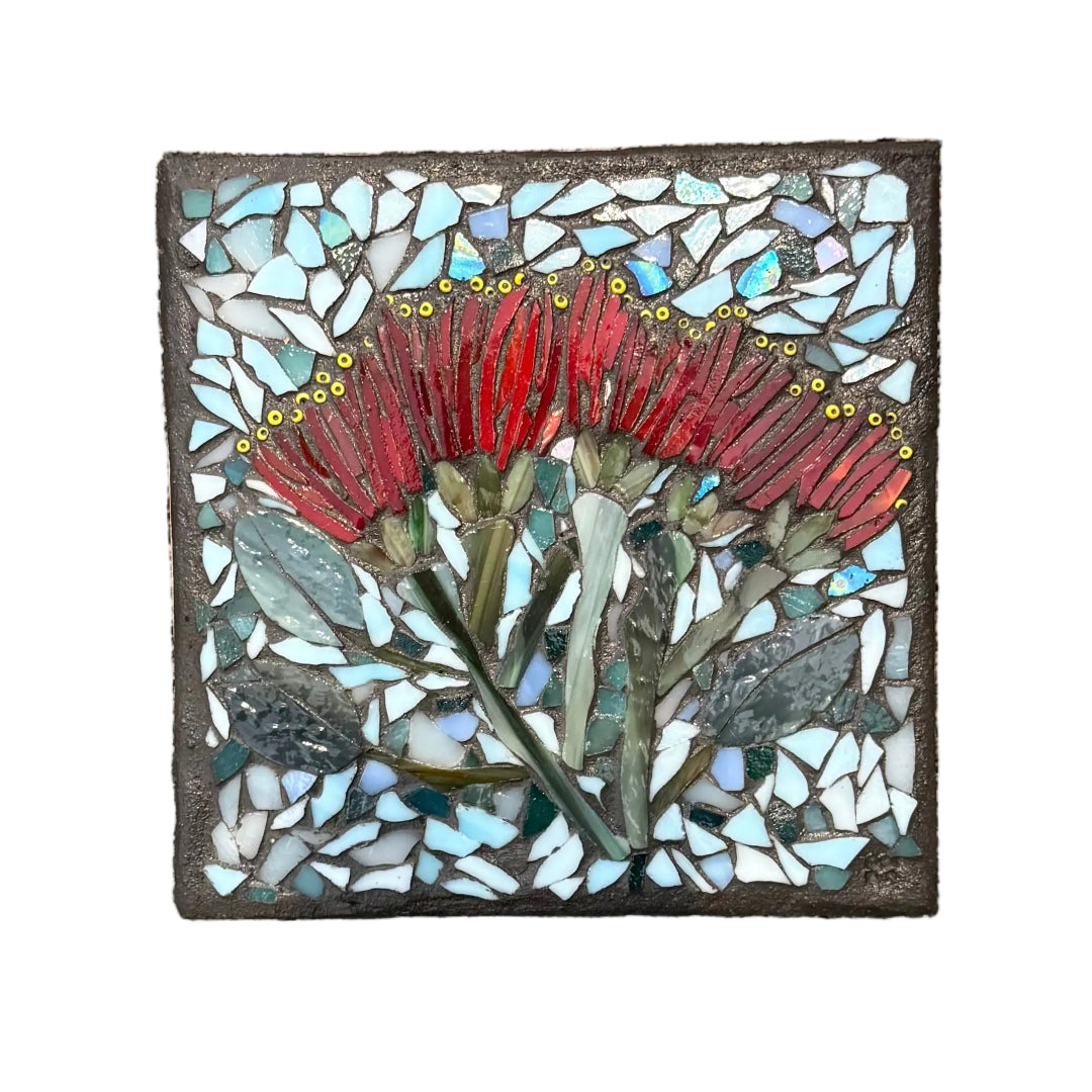 Glass Mosaic Red Pohutakawa Flower On A Ceramic Wall Tile On A White Wall