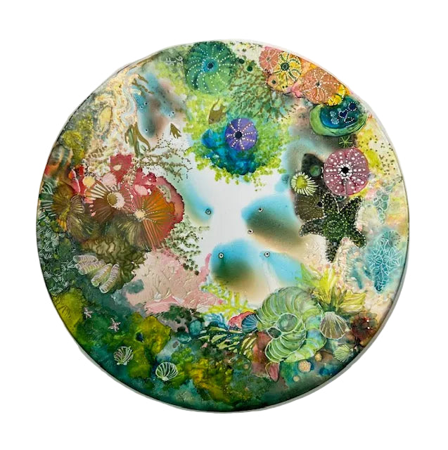 Round artwork with colorful floral patterns on a white background