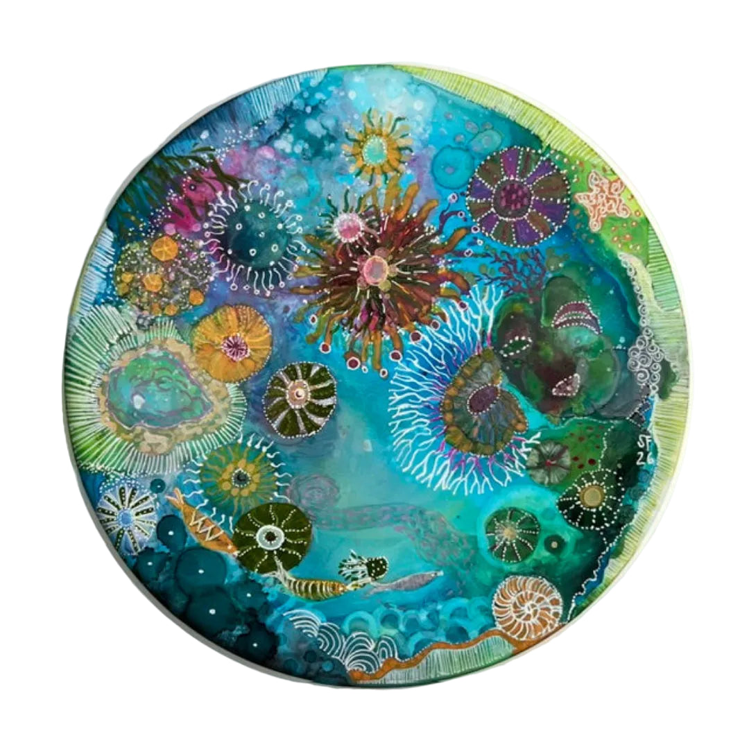 Circular artwork with colorful marine life design on a white background