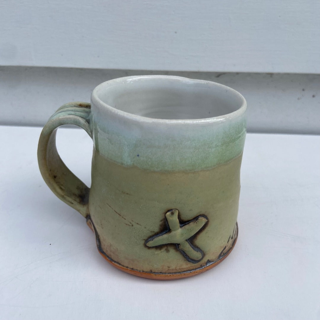 Yellow Cup with X and Man