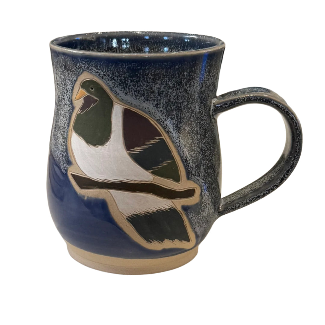 Blue Ceramic mug with a Kereru bird design on a white background