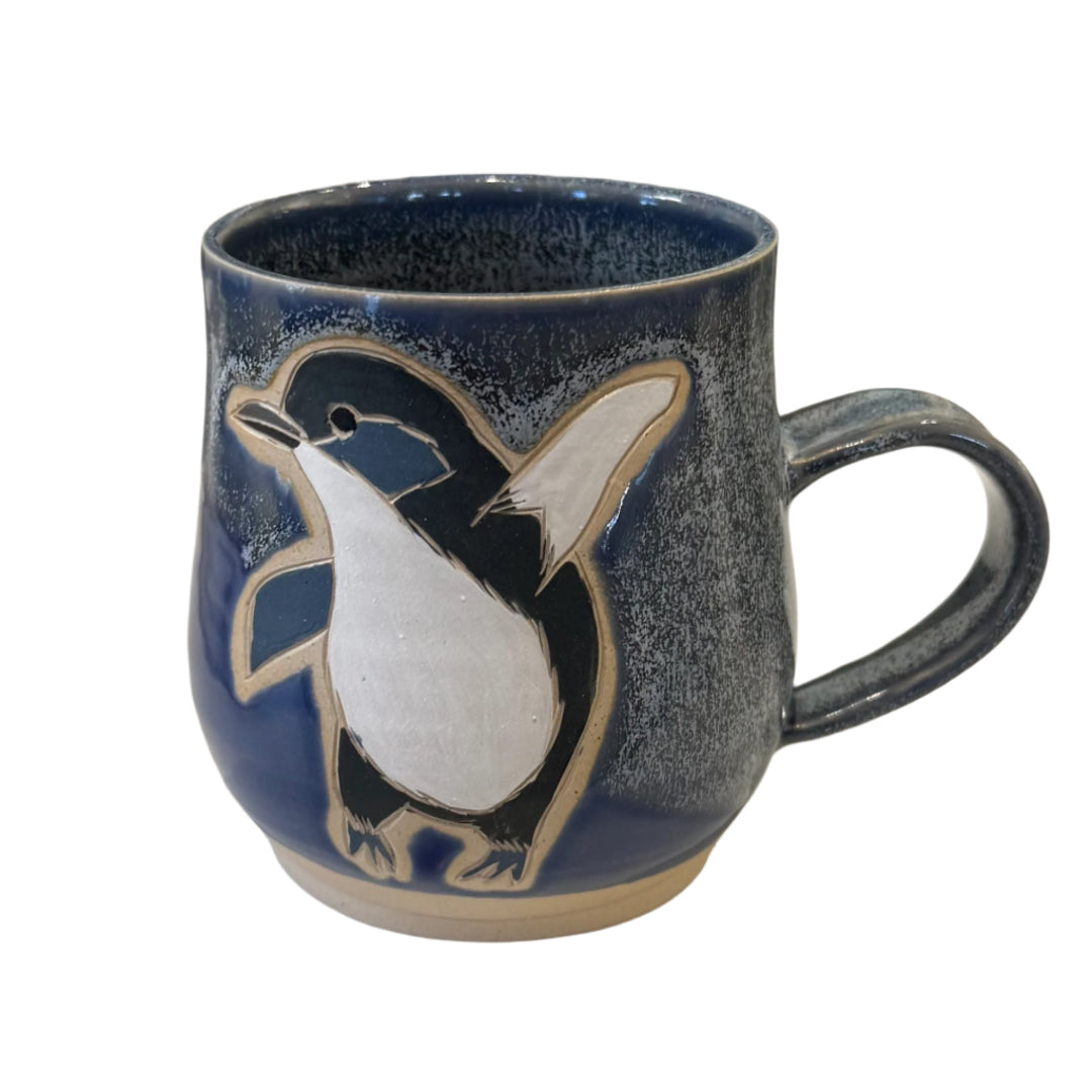 Blue Ceramic mug with a Penguin design on a white background