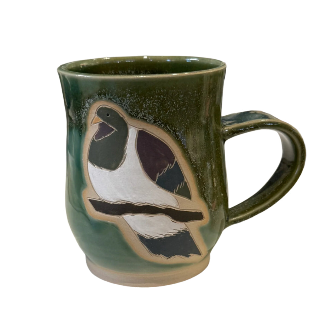 Green Ceramic mug with a Kereru bird design on a white background