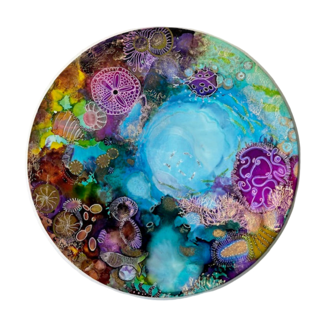 Circular original painting with colourful coral and fish design on a white background