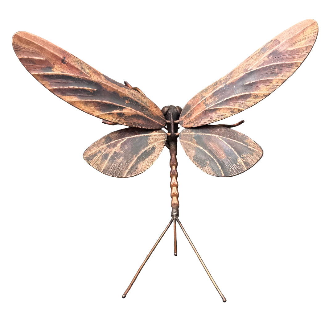 Decorative copper Mayfly on a white surface