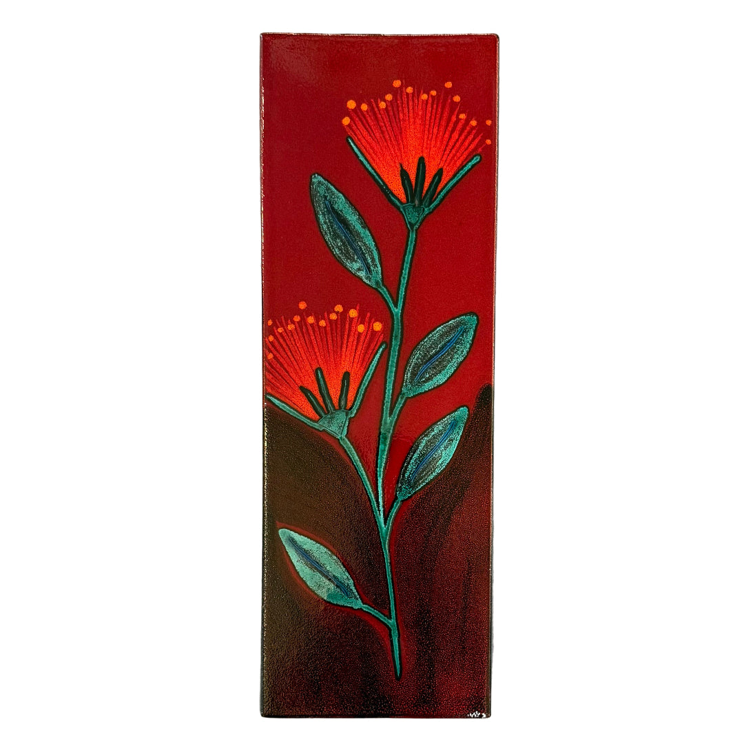 Rectangular ceramic tile with red pohutakawa tree design on a white background